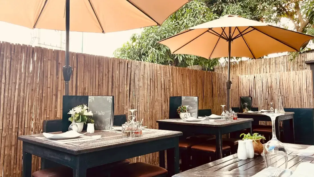 Terrace of the Prana Hotel restaurant, tables set under parasols